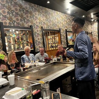 Group of friends enjoying hibachi dining experience at Jinbeh