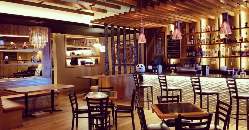 Jinbeh Frisco interior - warm wooden bar with pendant lighting and authentic Japanese ambiance near Stonebriar Centre