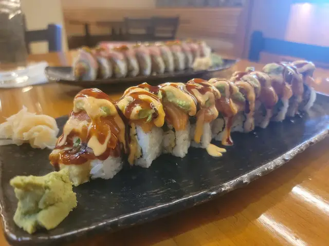 Artfully plated sushi rolls and nigiri at Jinbeh Japanese Restaurant