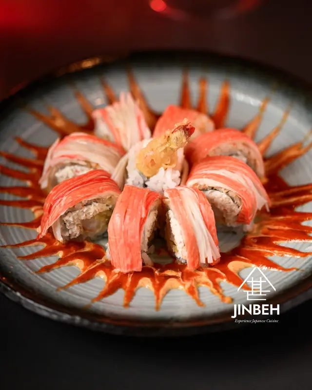 Crab pinwheel roll with tempura shrimp and eel sauce at Jinbeh